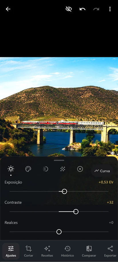 O editor do IMAGO com o painel Luz aberto: Exposição a +0,53 EV e Contraste a +32, com os valores alterados a dourado.